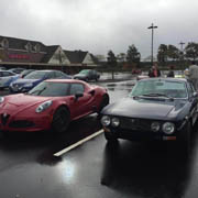Our Alfas etc. arrive in a damp Patriot Square parking lot